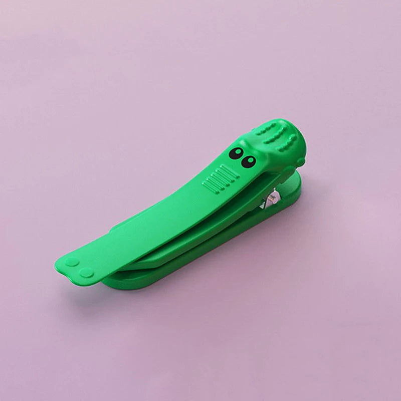 Croc Clip™ Segnalibro a clip in silicone antiscivolo (coccodrillo)